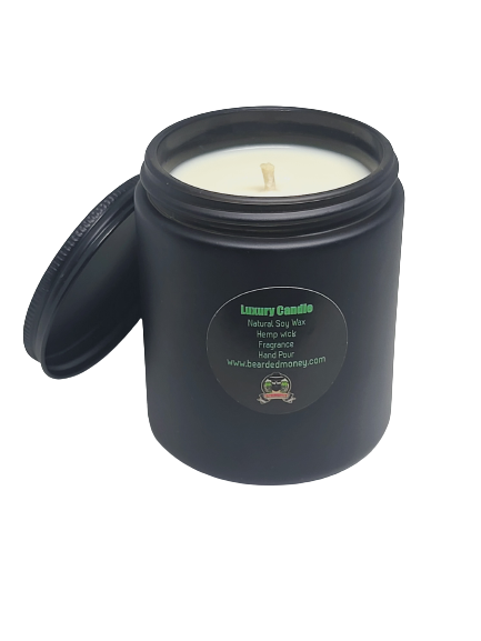 Loki soy wax candle in black metallic glass jar with lid. The candle has a clean and crisp scent; Loki candle is sculpted with strong minty herbal notes, notes of lavender, and patchouli