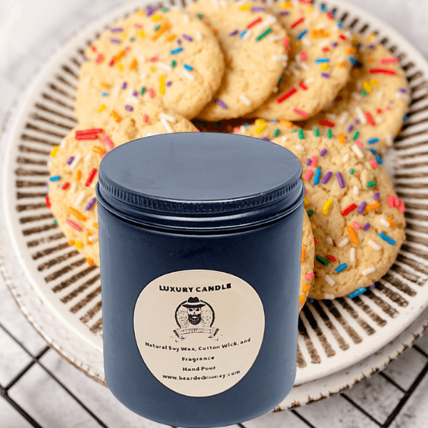 Sugar Cookie soy wax candle in  a black metallic glass jar with a lid. The candle smells like a sweet sugar cookie baked on a winter morning