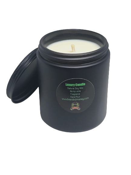 Sophisticated soy wax candle in a black metallic glass jar with a lid. The candle has A captivating scent for the sophisticated man. A citrusy, woodsy masculine