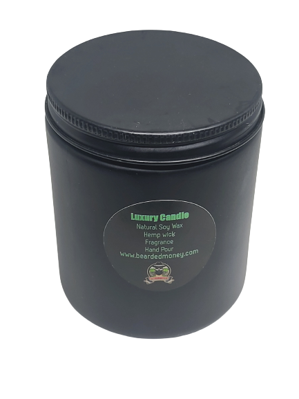 Sophisticated soy wax candle in a black metallic glass jar with a lid. The candle has A captivating scent for the sophisticated man. A citrusy, woodsy masculine